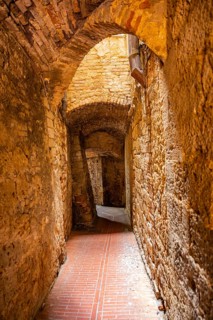 Old Town with stone arches and historic buildings of San Gimignano, Tuscany, UNESCO World Heritage,