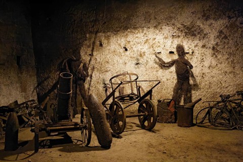 Second World War cannon and scrap on display in the Borbonica Gallery, Bourbon Tunnel, Naples