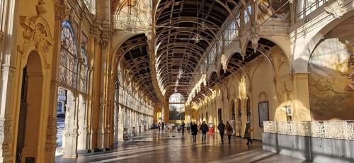 Historic arcades with frescoes where people walk along. Elegant ambiance, Maxim Gorky Kollonade,