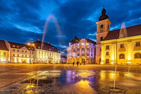 Fountain on Pia?a Mare Great Square, Brukenthal Museum, Sibiu City Hall and the Catholic Parish