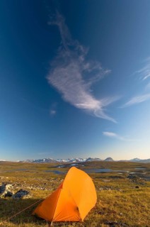 Tent in Stora Sjöfallet National Park, Laponia World Heritage Site, the Akka Massif on the horizon,