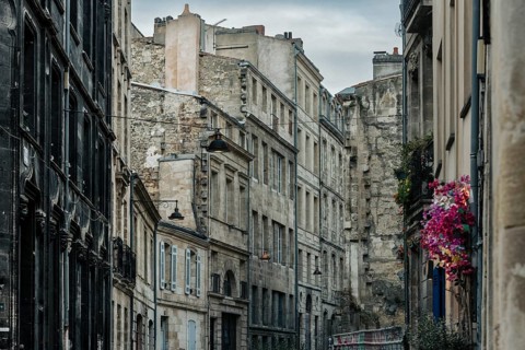 Dilapidated old town with floral decoration in Bordeaux, Gironde, France
