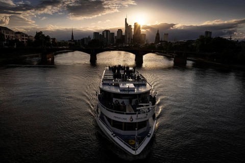 The sun sets behind Frankfurt's banking skyline, Frankfurt am Main, Hesse, Germany