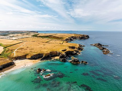 Farms and Fields over Cliffs and Porthcothan Bay from a drone, Porthcothan, Padstow, Cornwall,