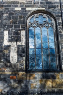 Sundial and church window of the Grote Kerk, originally Middle Ages, fundamentally changed in the