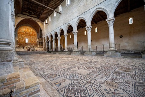 Basilica di Santa Maria Assunta, Basilica of Aquileia with historic floor mosaic in the main nave,