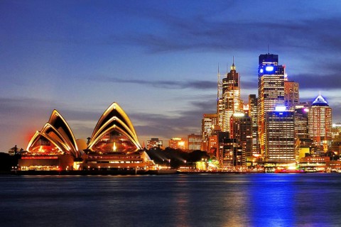 Sydney skyline with Sydney Opera and luxury liner Queen Mary 2 during the blue hour, Circular Quay,