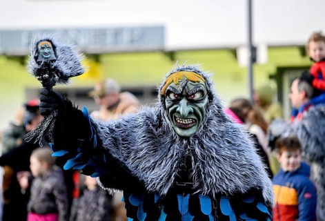 Member of a fools' guild in traditional Haes, fools' clothes, during the carnival procession in