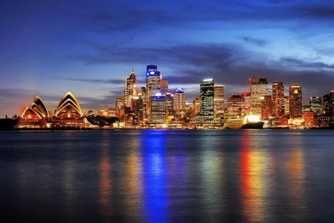 Sydney skyline with Sydney Opera and luxury liner Queen Mary 2 during the blue hour, Circular Quay,