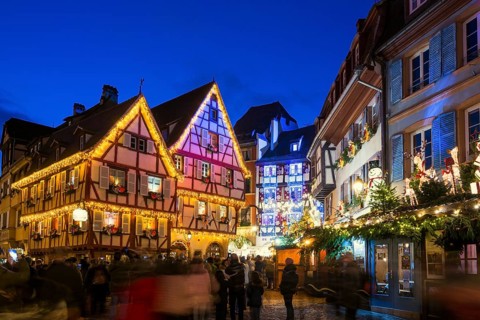 Colourfully illuminated and Christmassy decorated half-timbered houses, old town, blue hour,