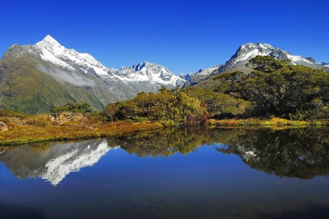 Key Summit with reflection of Mt. Christina, Fjordland National Park, World Heritage Site South