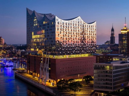 Aerial view of the sunrise on the Elbe with Elbe Philharmonic Hall and St Michael's Church
