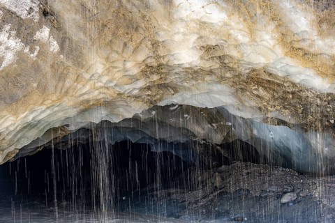 Meltwater at a glacier cave, underground glacier stream, Castner Glacier, Delta Range, Alaska