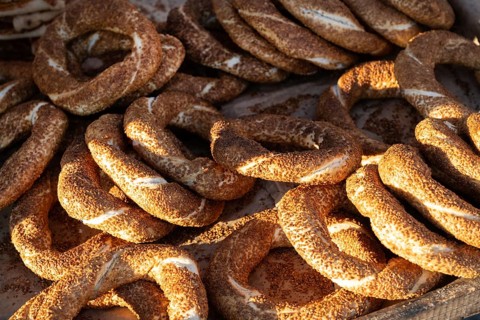 The sesame seed encrusted Simit, known as the Turkish bagel a popular street food sold from street
