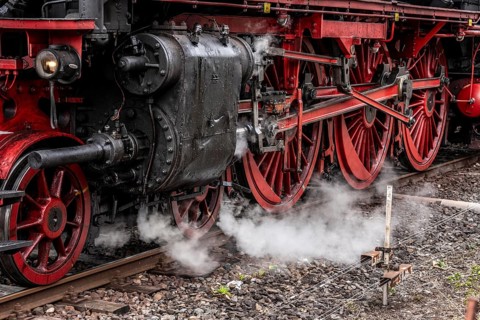 Detailed view of the drive wheels and coupling rods of a steam locomotive, Bochum railway museum,