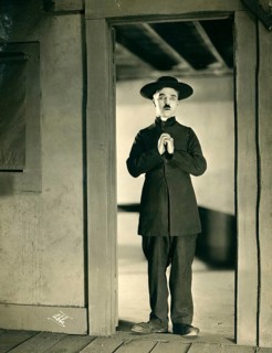 Charly Chaplin, The Tramp, silent film, 1915, disguised, priest, vagabond, comedian, USA, A man in
