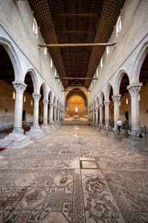 Basilica di Santa Maria Assunta, Basilica of Aquileia with historic floor mosaic in the main nave,