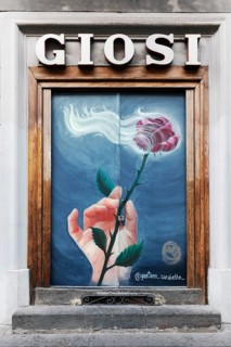 Hand holding rose, mural at an art supplies store by Gaietano Saraiello, historic center, Naples,