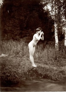Nudism, life reform, nude, nature, art nouveau, woman in natural environment leaning over a stream,