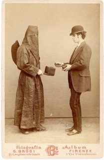 Hypnosis, young man, scene 1, A man in a suit and hat faces a masked figure, Giacomo Brogi, Italy,
