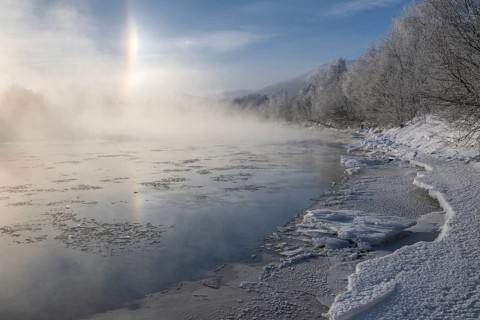 Fog and parhelion over the river Glomma (Glåma), Alvdal, Hedmark, Innlandet, Norway, February 2026