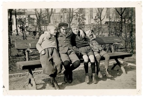 Friends, children, gang, rascal, four boys sitting together on a park bench, cheerful scene, around