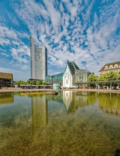 Morning atmosphere, Leipzig Augustusplatz with Gewandhaus, Mendebrunnen, city skyscraper and