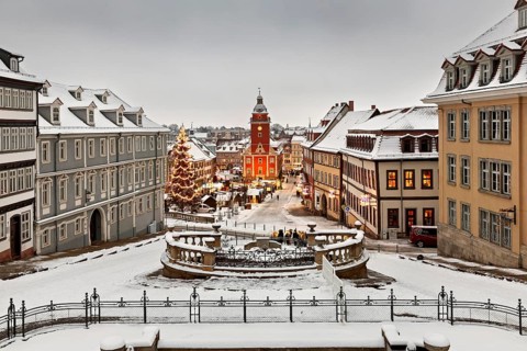 Snowy old town with festive lighting and Christmas tree in a wintry atmosphere, the old town of