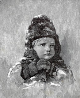 Portrait of a small child wearing warm winter clothes, including a distinctive, voluminous fur hat
