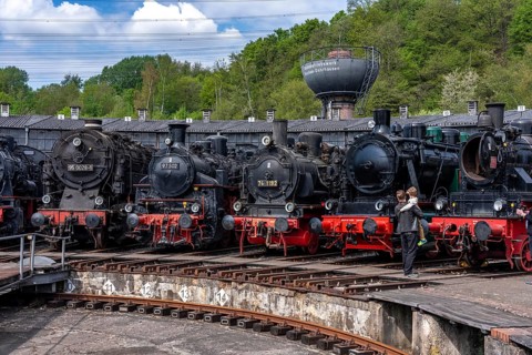 Ring locomotive shed with many historic steam locomotives in the Bochum Railway Museum, museum days