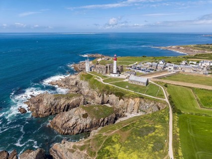 Aerial view of the distinctive red and white lighthouse Phare de Saint-Mathieu on the Breton coast