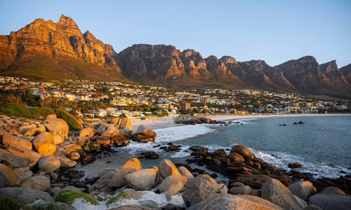 Evening on the coast, beach near Camps Bay, with table mountains, blue sea, Cape Town, South Africa