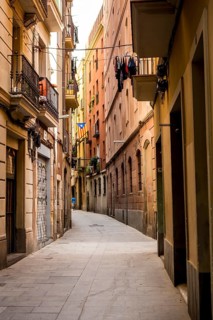 A narrow street in the Gothic Quarter (Barri Gòtic) of Barcelona's Old Town, Spain
