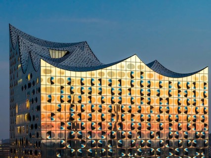 Aerial view of sunrise on the Elbe with Elbe Philharmonic Hall and reflections in the glass façade,