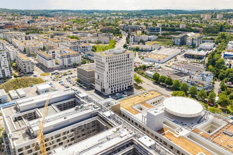 Urban panorama with views of modern buildings and roofs taken from the air, Neubau Krankenhaus,