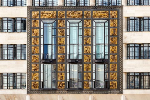The gilded Frank Dobson relief panels on the Art Deco facade of St Olaf House, London Bridge