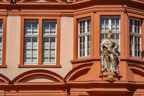 Figure of a Roman Emperor at the House of the Roman Emperor with Gutenberg Museum on