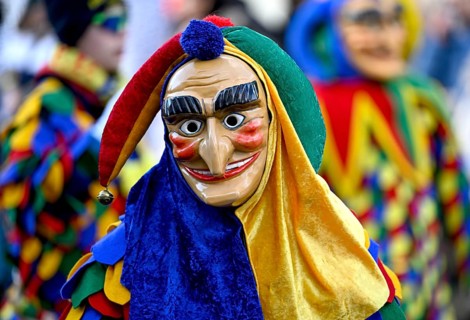 Member of a fools' guild in traditional Haes, fools' clothes, during the carnival procession in