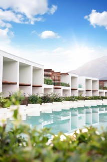 Hotel, Antalya, Turkiye. Modern resort located near calm waters. The design features open spaces