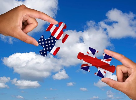 Two hands each holding a puzzle piece, silhouette, confrontation, rapprochement, war, trade war,