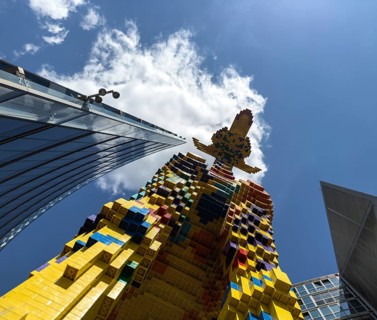 Frog's eye view, The Lego giraffe in front of LEGOLAND at Potsdamer Platz, Berlin, Germany