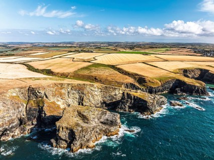 View of cliffs over Gunver Head and Trevone Bay from a drone, Trevone, Padstow, Cornwall, England,