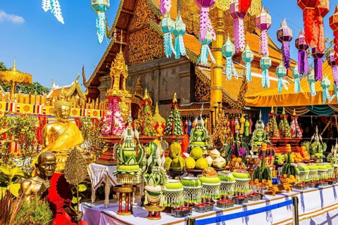 Sacrificial table with offerings and colorful lanterns lined up in the Wat Phra That Doi Suthep