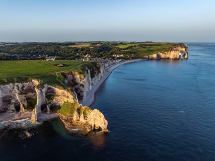 Aerial view of the Porte d'Amont rock formation, Falaise d'Amont shortly after sunrise, a landmark