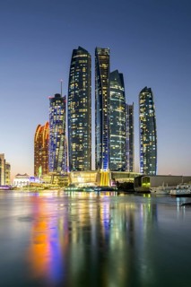 Abu Dhabi Skyline Etihad Towers skyscrapers at night in Abu Dhabi, United Arab Emirates