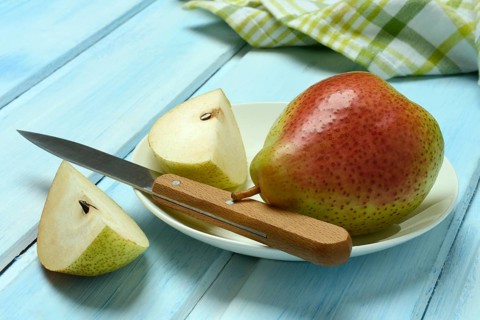 Pears on plate, cut with knife