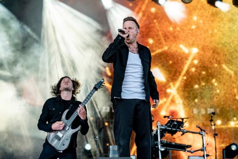 Singer Sam Carter from the British metalcore band Architects live on the Utopia Stage during the