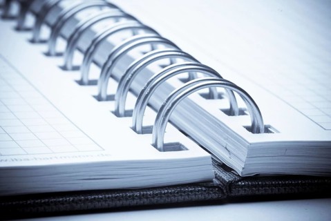 A blank checkered notebook, notes