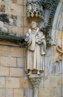 Statue of Martin Luther on the façade of the Protestant Margaret Church, late Gothic hall church,