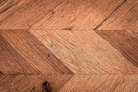 Close-up view of a rustic wooden surface showcasing intricate natural textures and patterns,